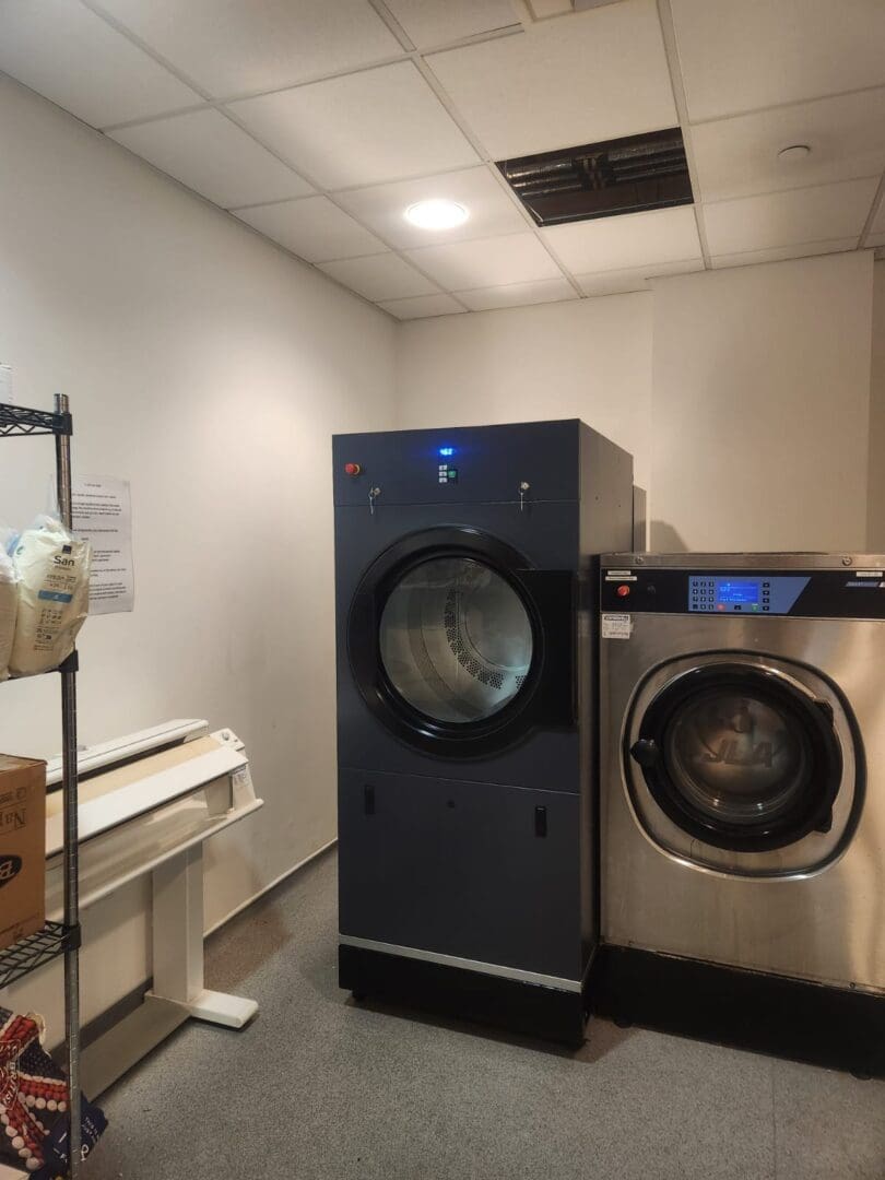 Laundry room with two washing machines.